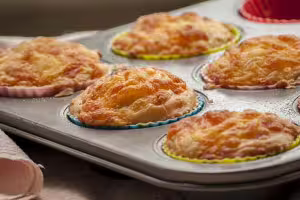 Savory muffins with bacon bits and grated cheese